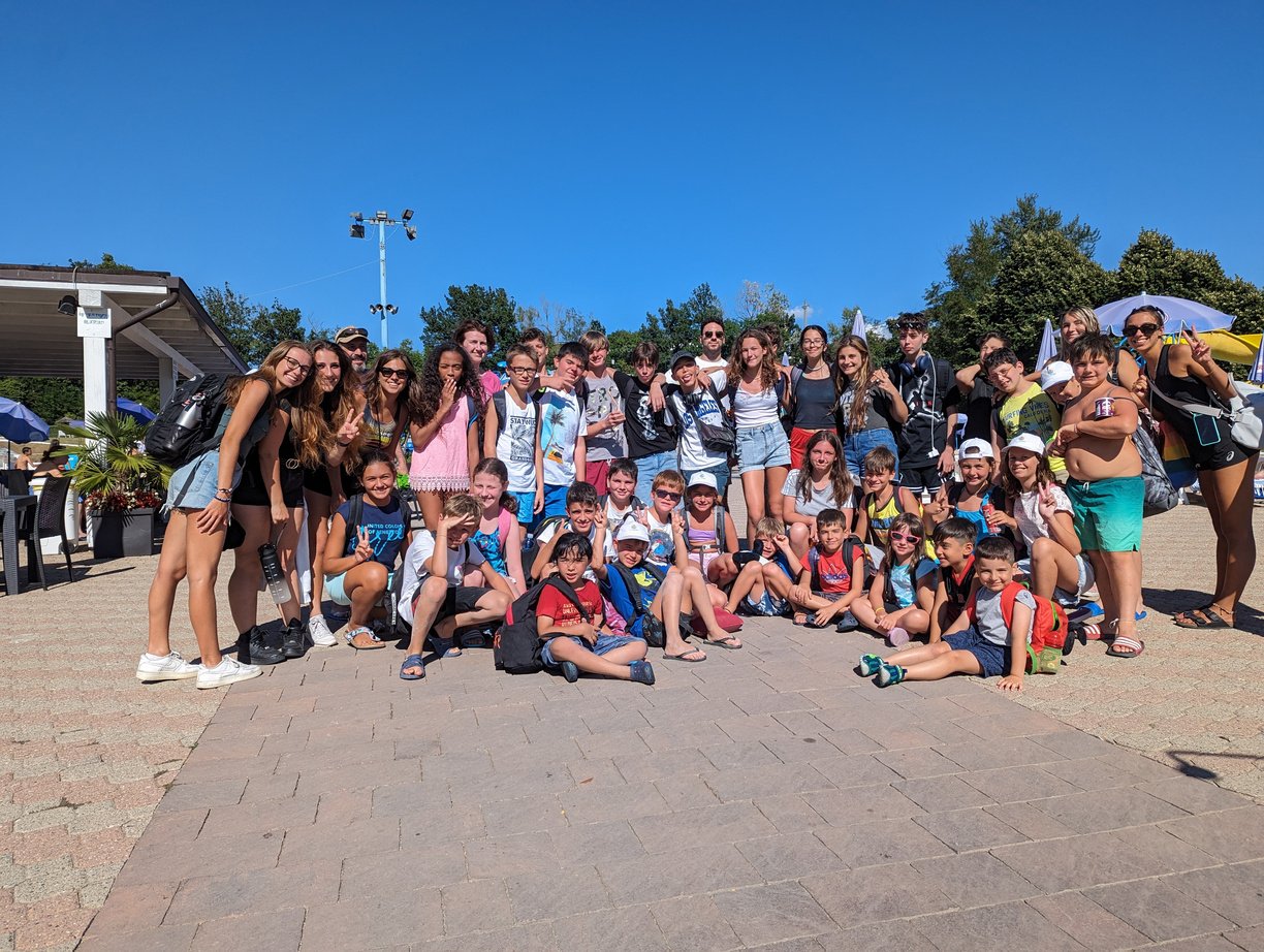 a group of people posing for a photo in a water park